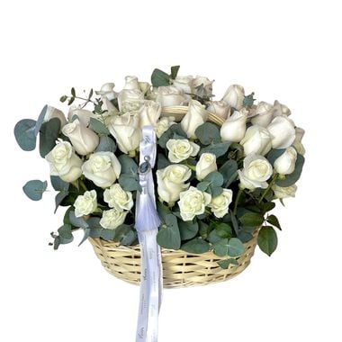 faces white roses and eucalyptus basket