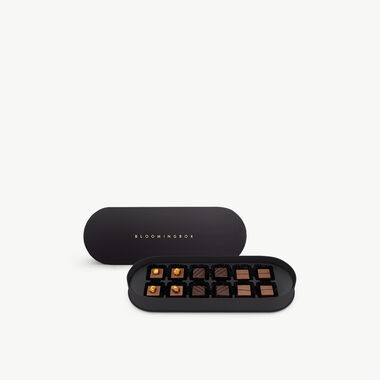 faces small chocolates oval black box
